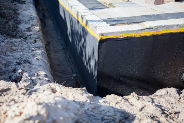 Professional Basement Waterproofing technician working in River Rouge, MI